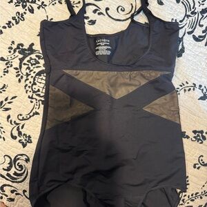 Cacique Open-Bust Bodysuit in Black
Shape wear. Brand new no tags